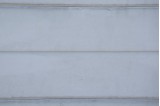 Zoom sur motif lames plates et larges de la plaque béton Moderne
