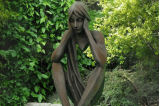 Statue de jardin Tristan assis pierre reconstituée H. 86 cm